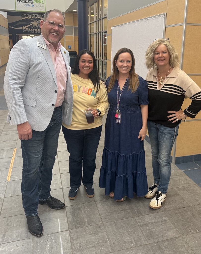 corey homer takes a photo with teachers 