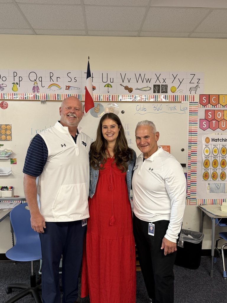 shawn pratt and harvey oaxaca take a photo with a teacher 