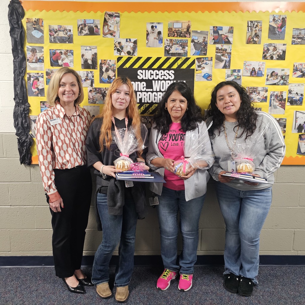 alana chisum takes a photo with teachers 