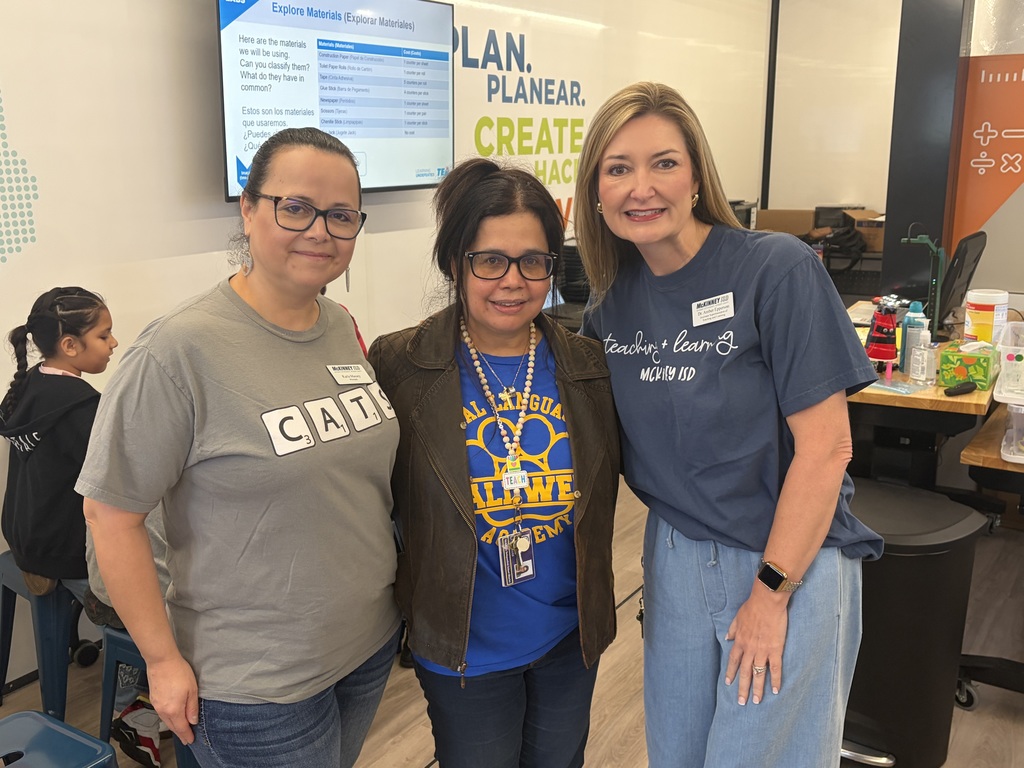dr. amber epperson takes a photo with a teacher at caldwell dual language academy 