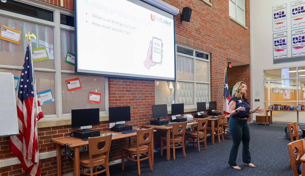 students participate in a lesson about personal financial literacy