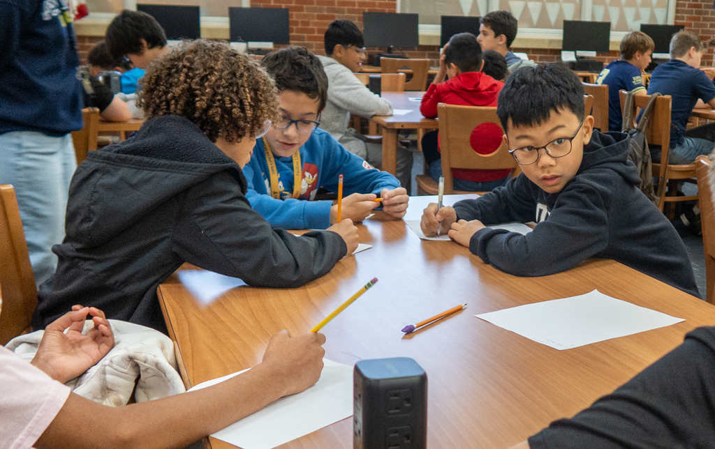students participate in a lesson about personal financial literacy