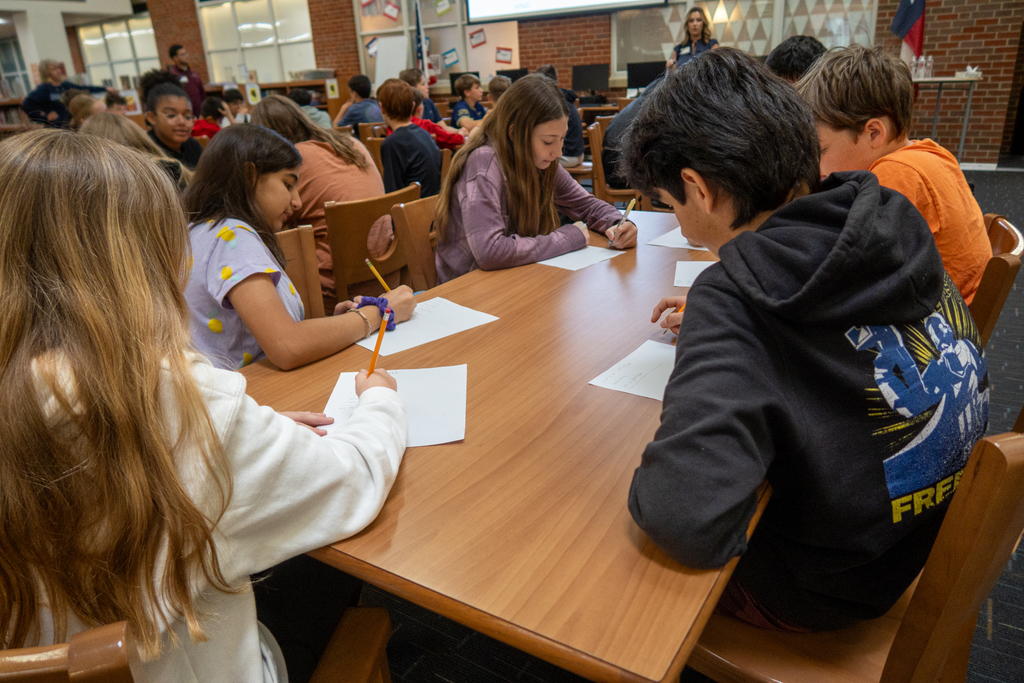 students participate in a lesson about personal financial literacy