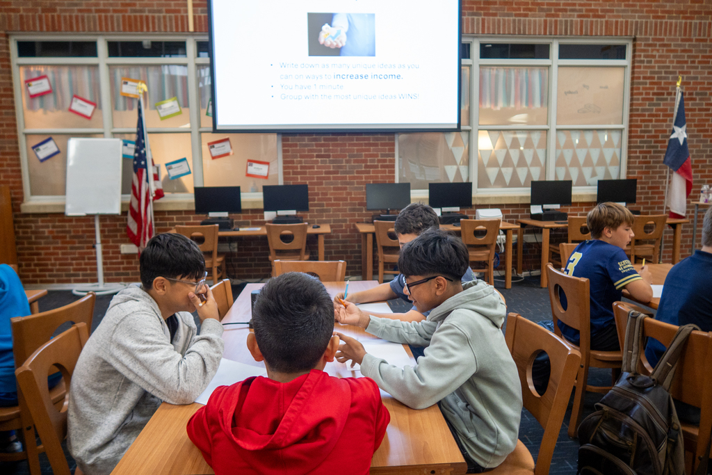 students participate in a lesson about personal financial literacy