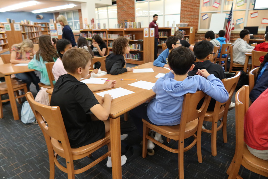students participate in a lesson about personal financial literacy 