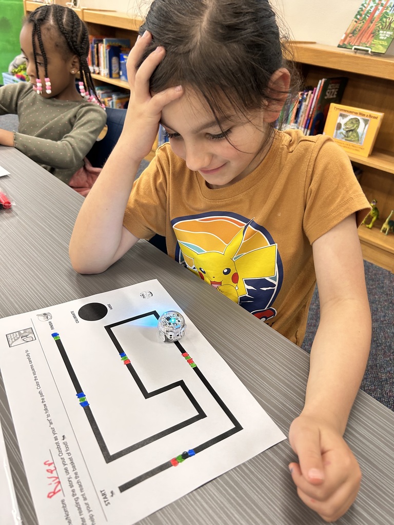 Kindergarteners learning how to code an Ozobot