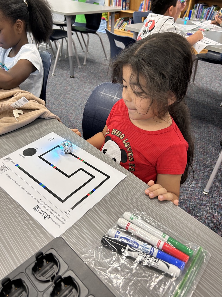 Kindergarteners learning how to code an Ozobot