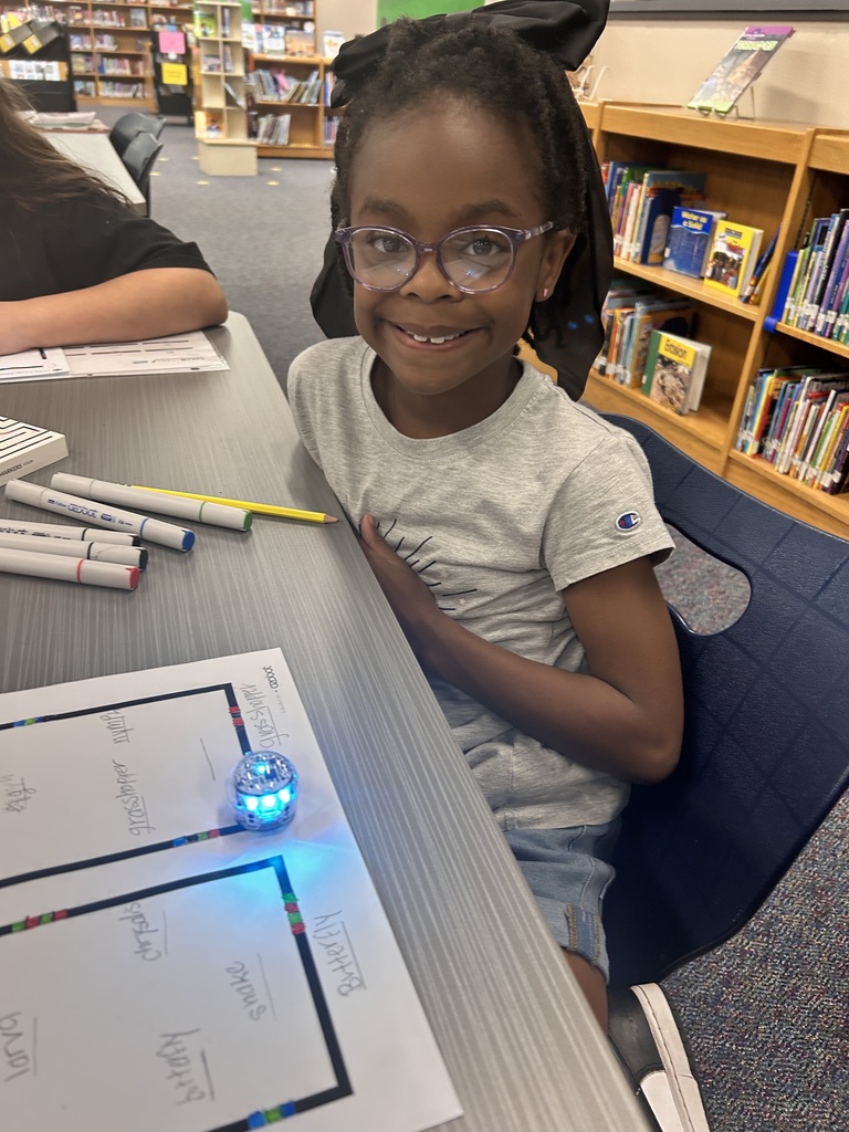 3rd graders applying what they learned about life cycles  while coding Ozobots.