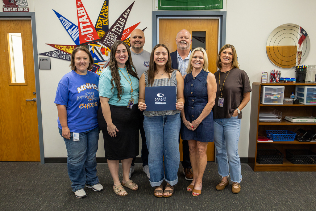 group photo with Lizzy holding award certificate