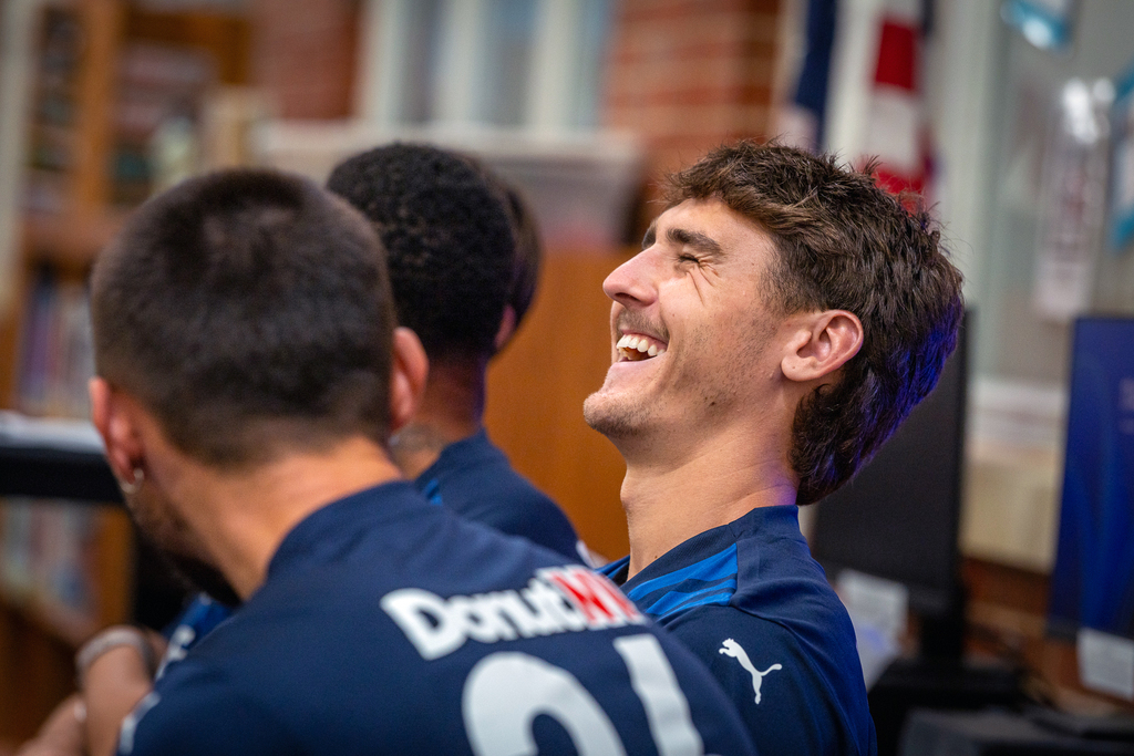 player with head back laughing