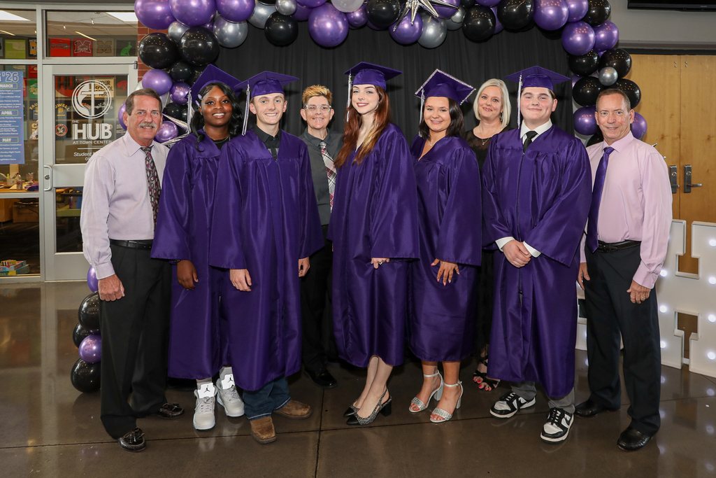 graduates with serenity high assistant principal and staff members
