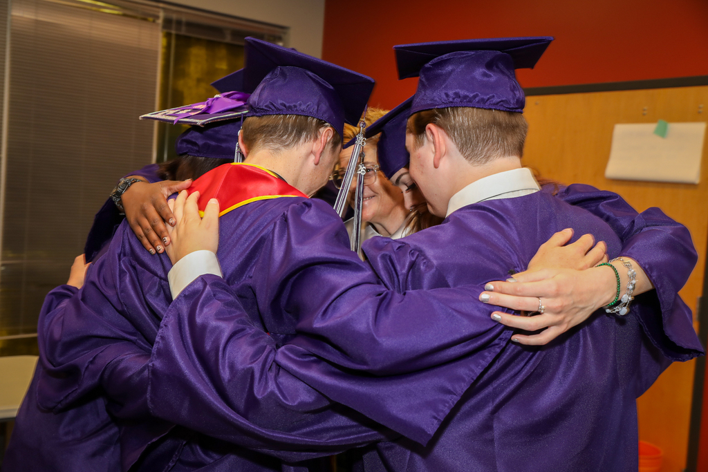 graduates huddled up with allie long