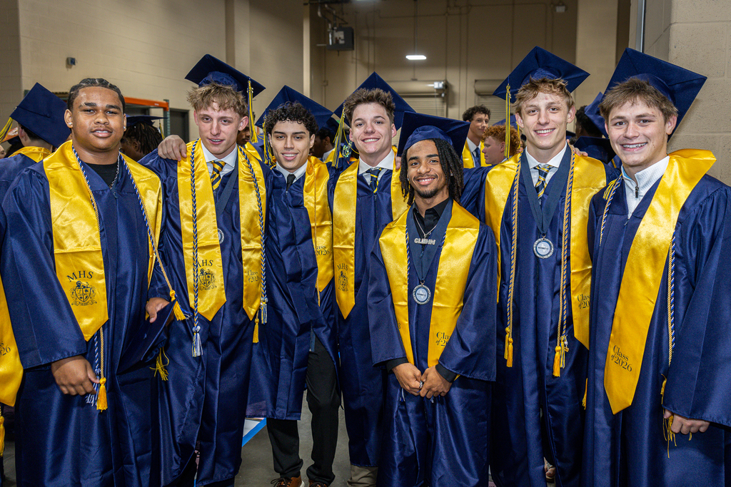 group of male graduates  backstage before the ceremony