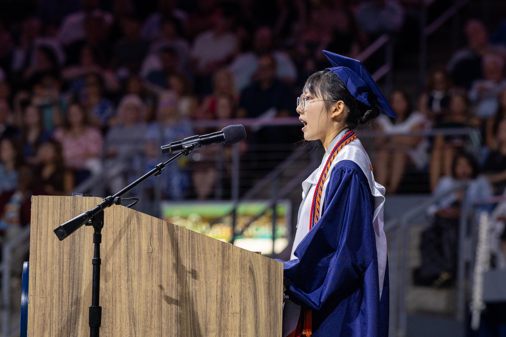 female graduate at the podium