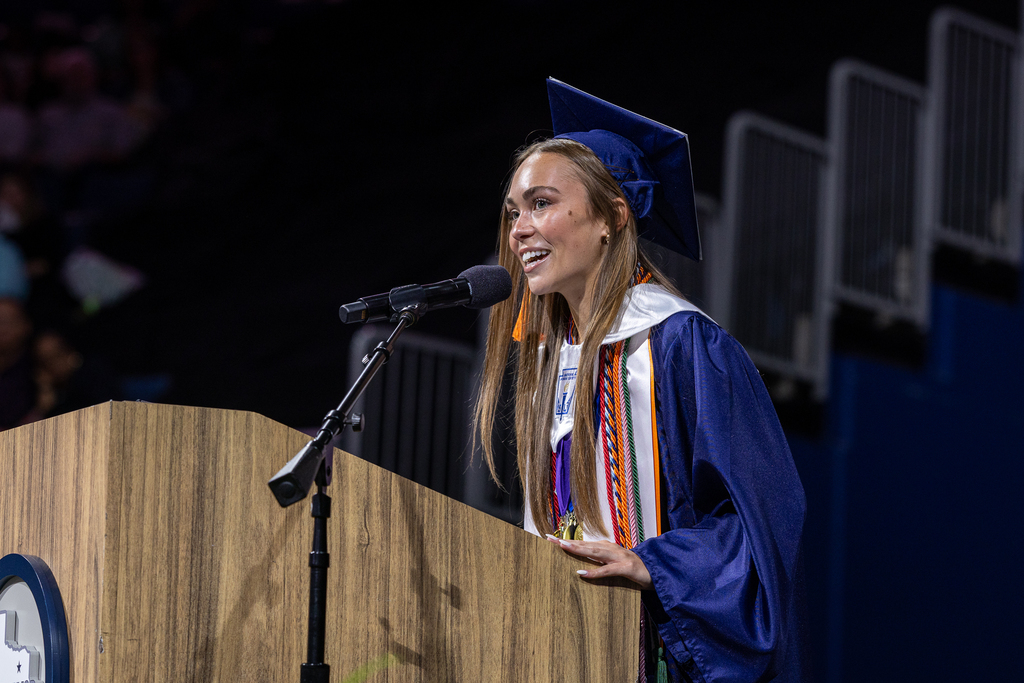 female graduate at the podium 