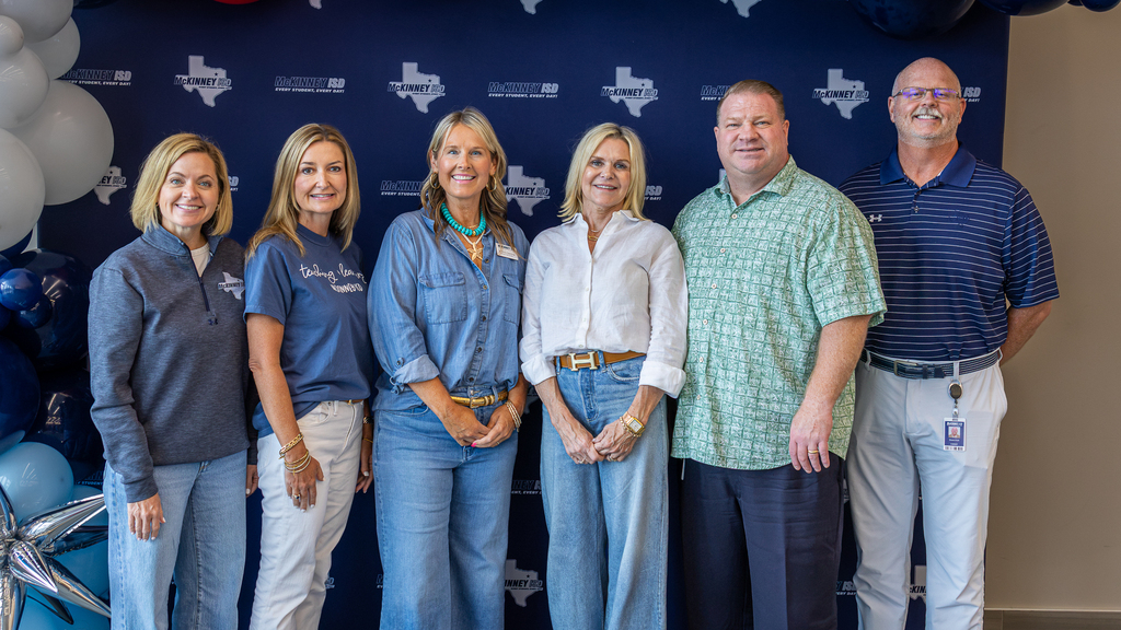 MISD cabinet and superintendent in front of MISD backdrop