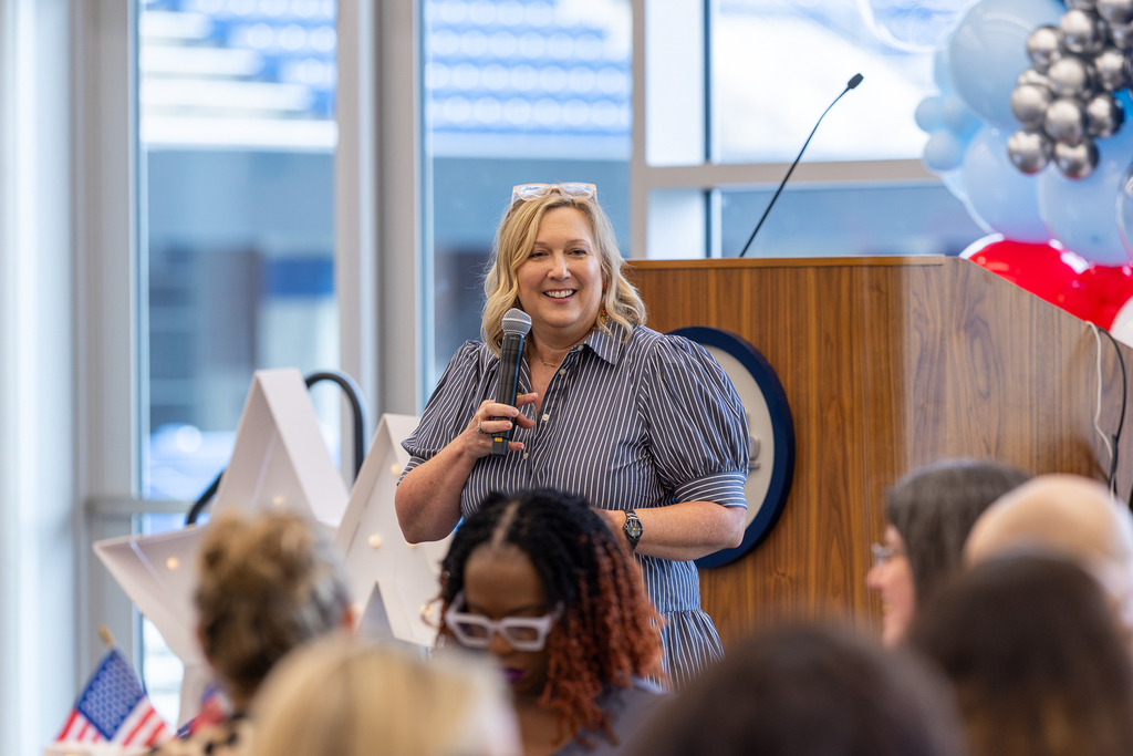 presenter Paula Maeker speaking with the microphone