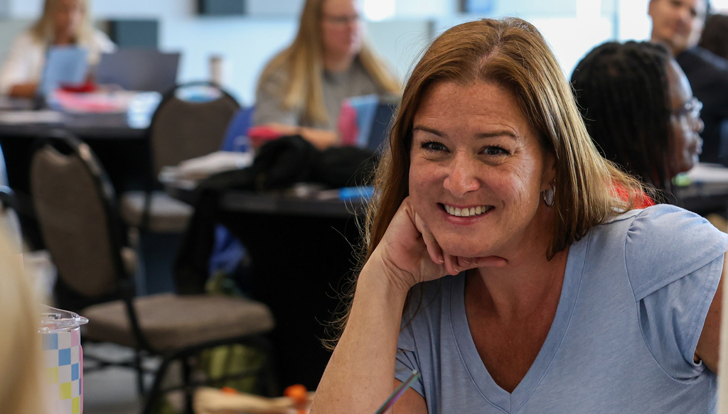teacher smiling at camera