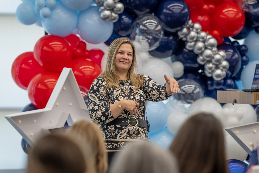 presenter Kristin Poage up front gesturing