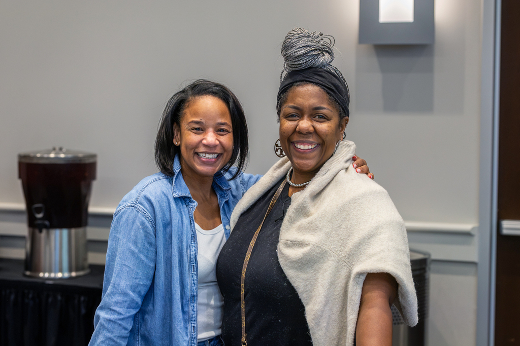 female principal and teacher smiling for camera