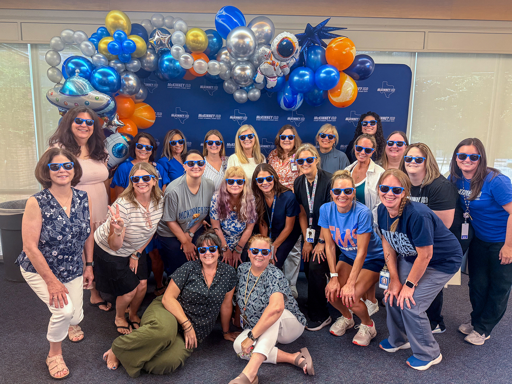 group photo of nurses and nurse assistants with glasses on