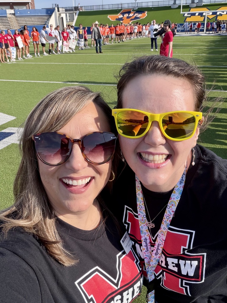 Jennifer Larriviere, Principal, posed with Brooke Hancock, 3rd grade teacher, on the field.