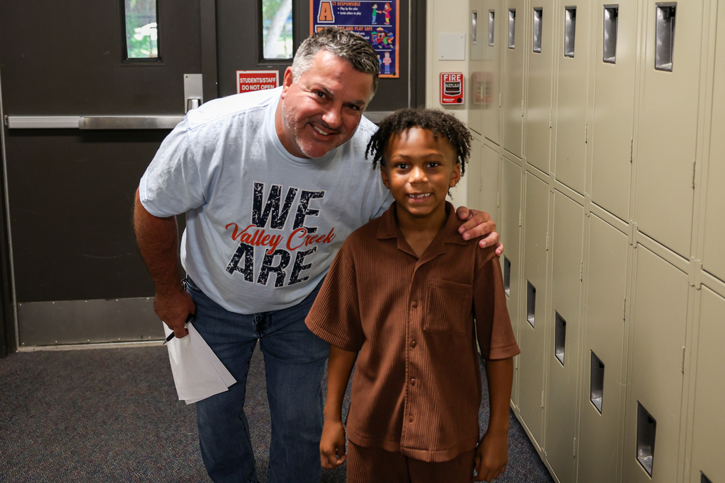 a student poses for a photo at elementary meet the teacher