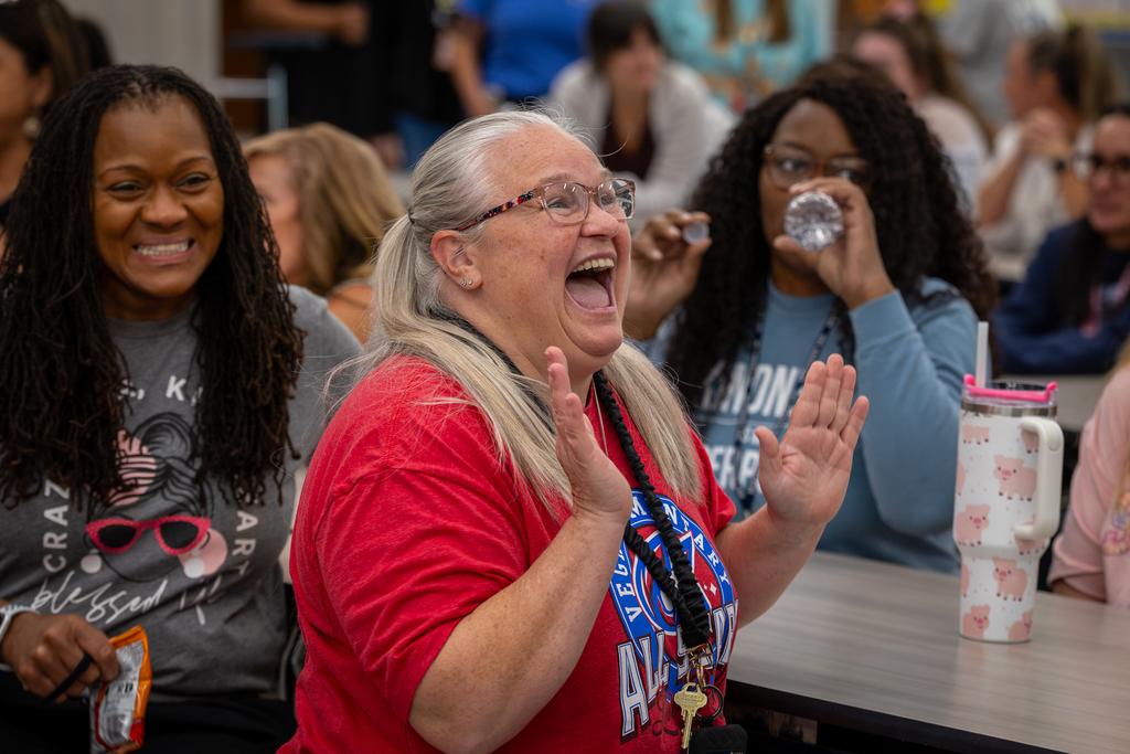 teacher reacting with huge smile