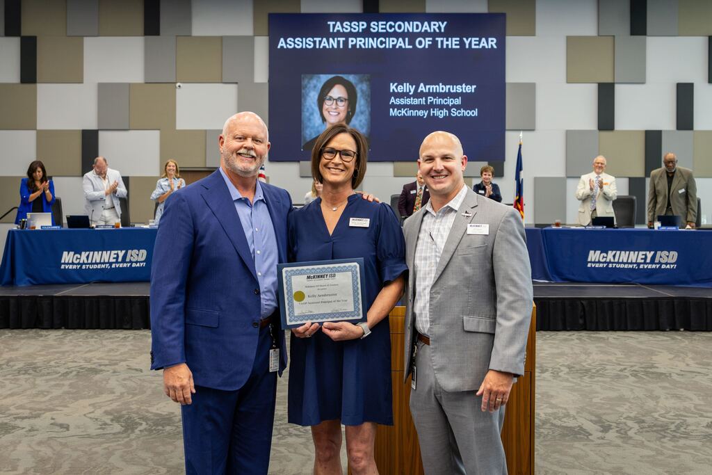 Kelly Armbruster receiving award for the TASSP Secondary Assistant Principal of the Year at the McKinney ISD Board meeting.