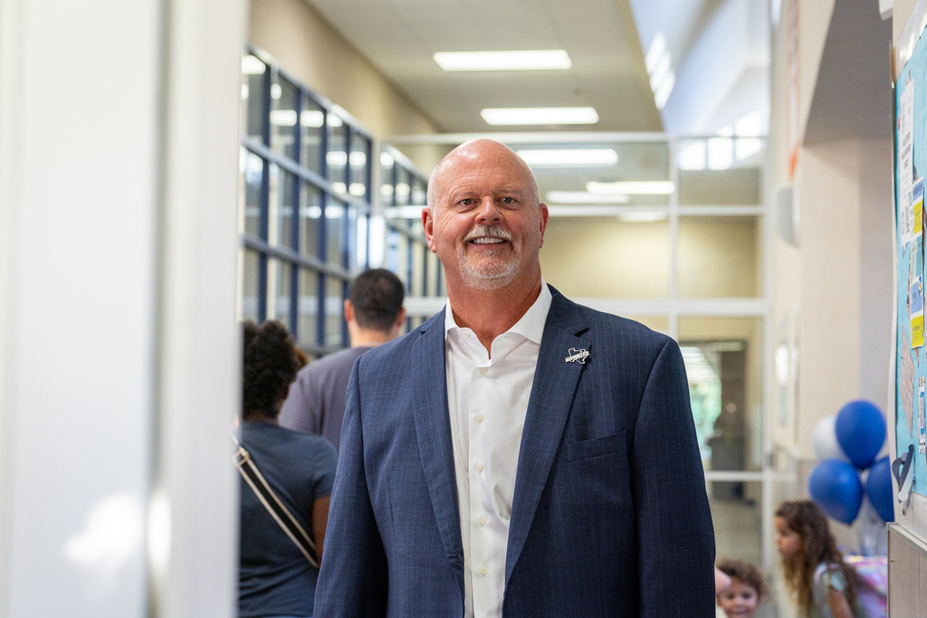 Shawn Pratt smiling in the hallway at McGowen