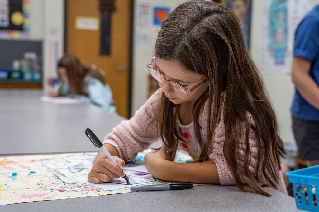 girl in art class working on design