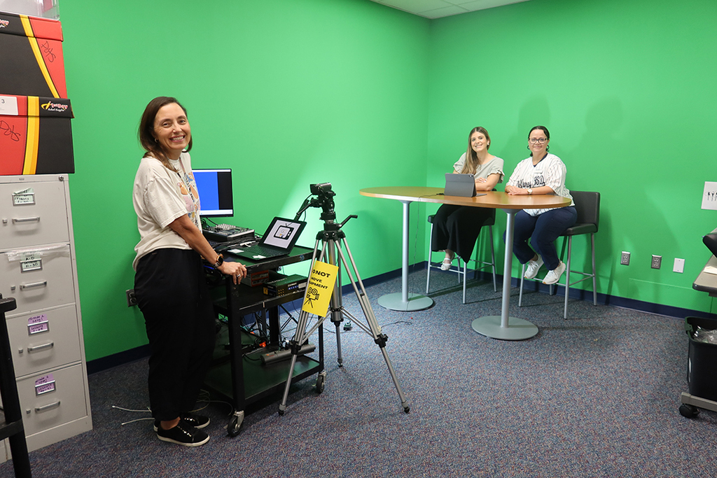 Caldwell principal and AP in green room for morning announcements