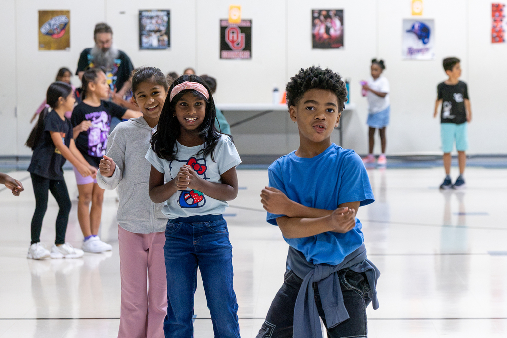 students in the gym dancing during exercise activity