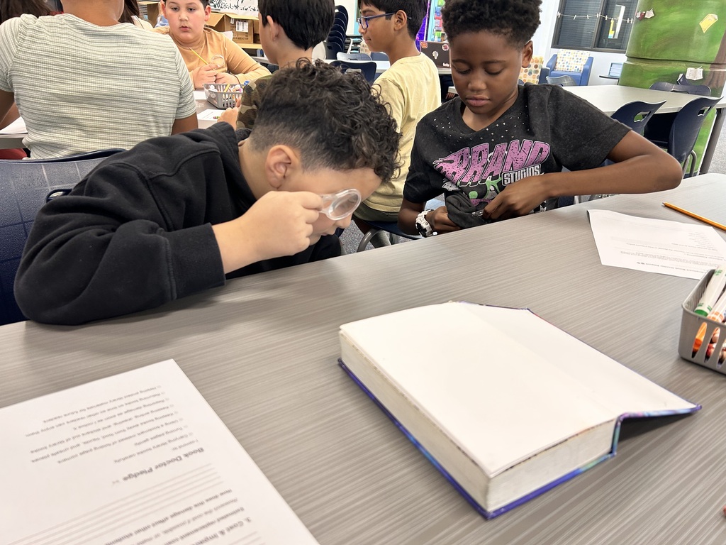 Students being book doctors in the library.