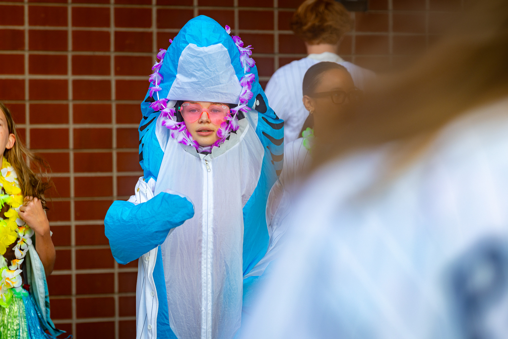 girl in shark costume with pink heart sunglasses on