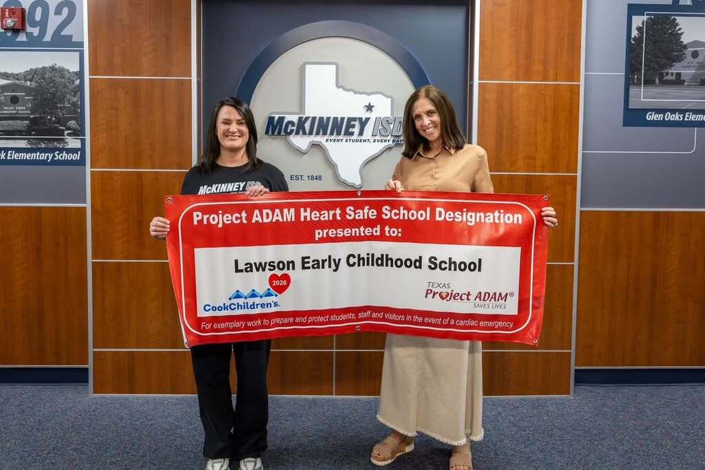 Nurse Beaverson and Mrs Towber with Project Adam Banner