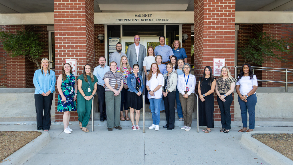 group in front of central office