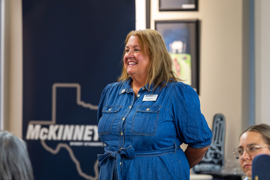 Holly Rogers speaking and smiling