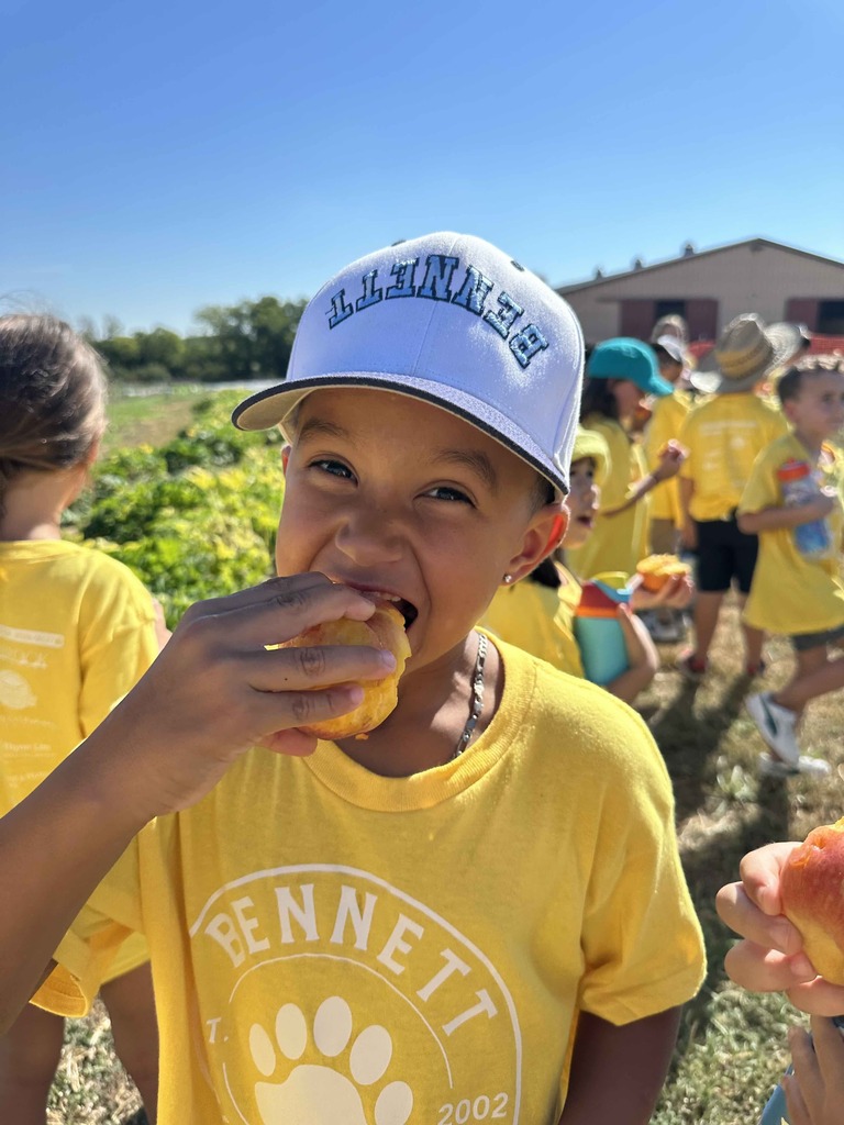 One student enjoying a fresh peach