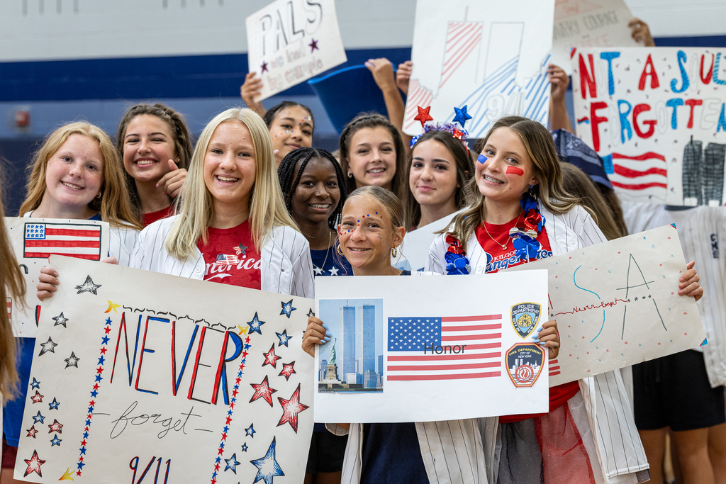 group of PALS students holding up signs before parade