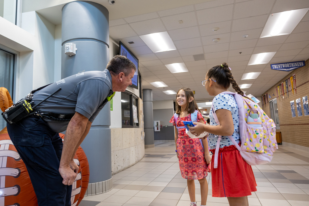 student greet a first responder at Vega