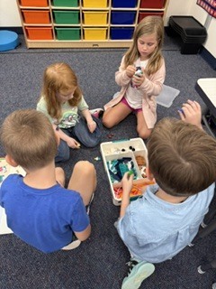 Group of 1st graders combining their builds