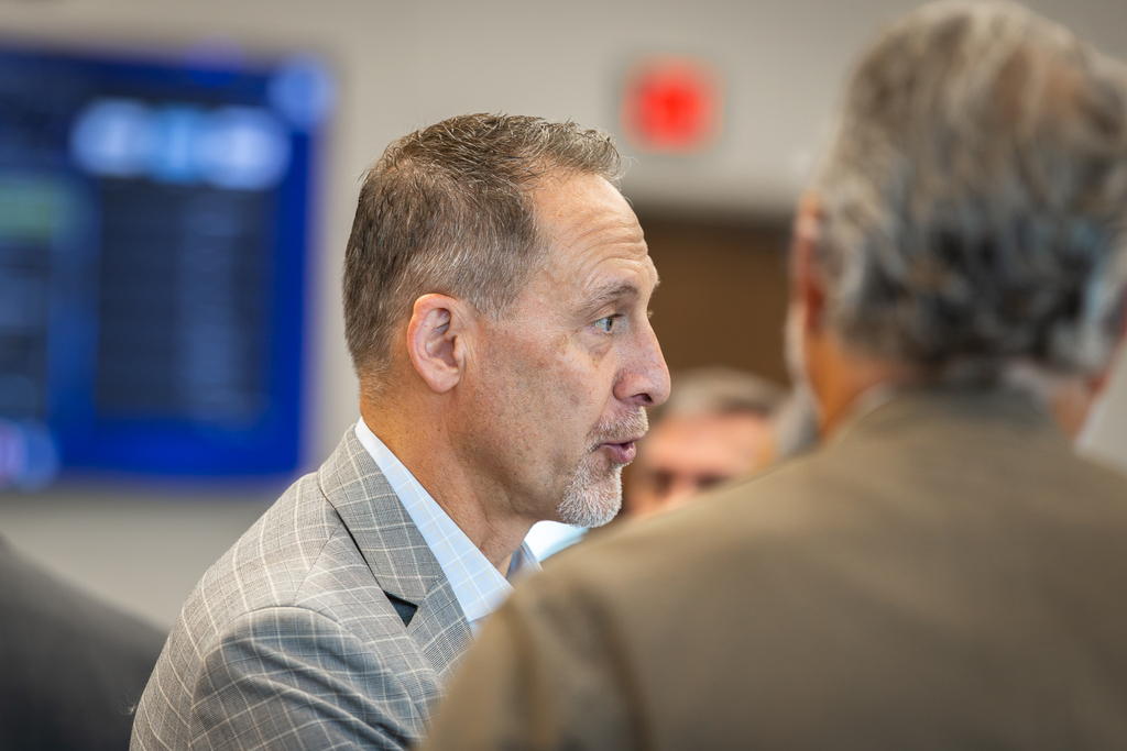 paul grimes talking with other attendees