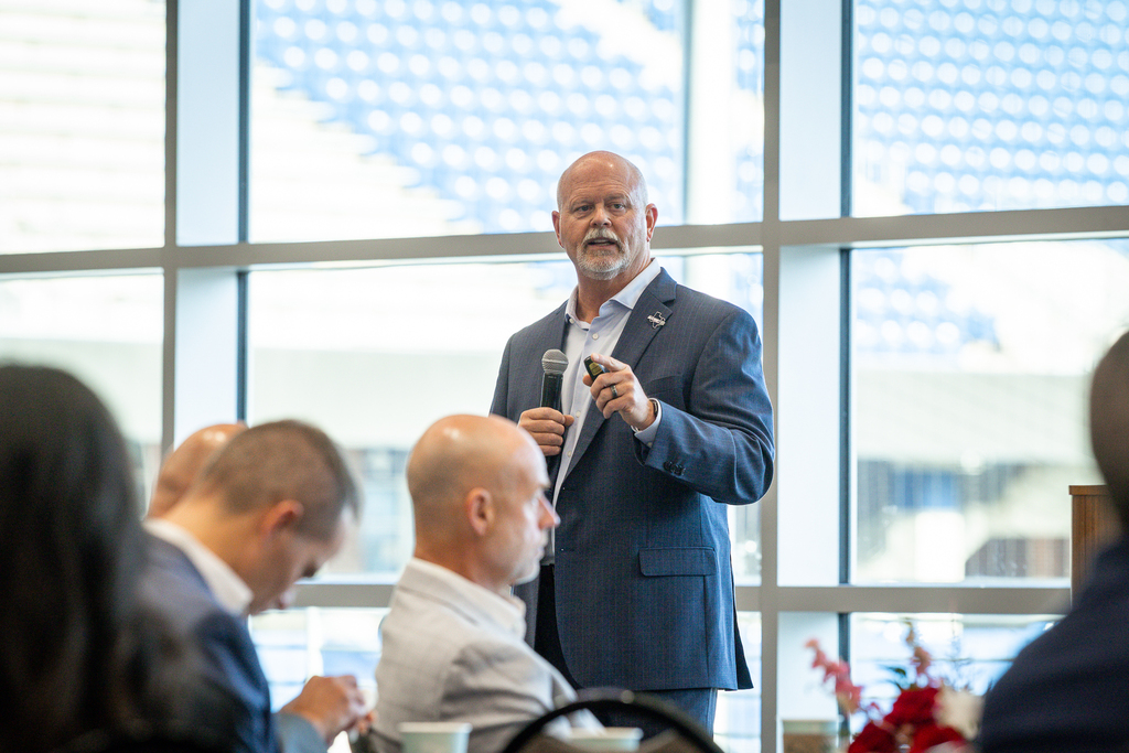 pratt speaking with microphone