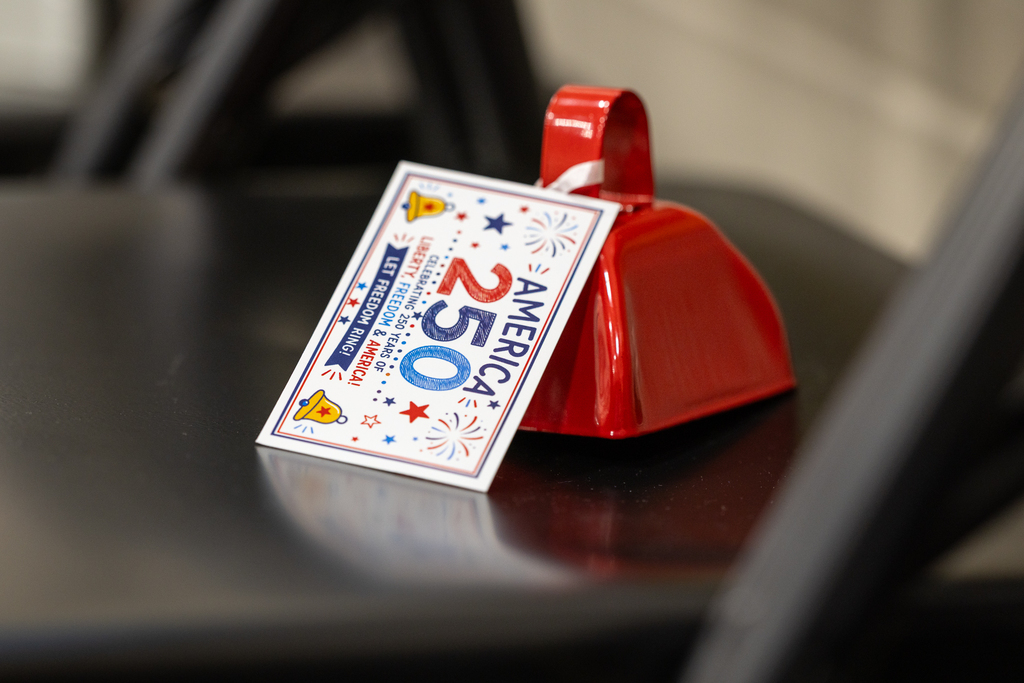bell with tag on it that reads America 250 Let Freedom Ring
