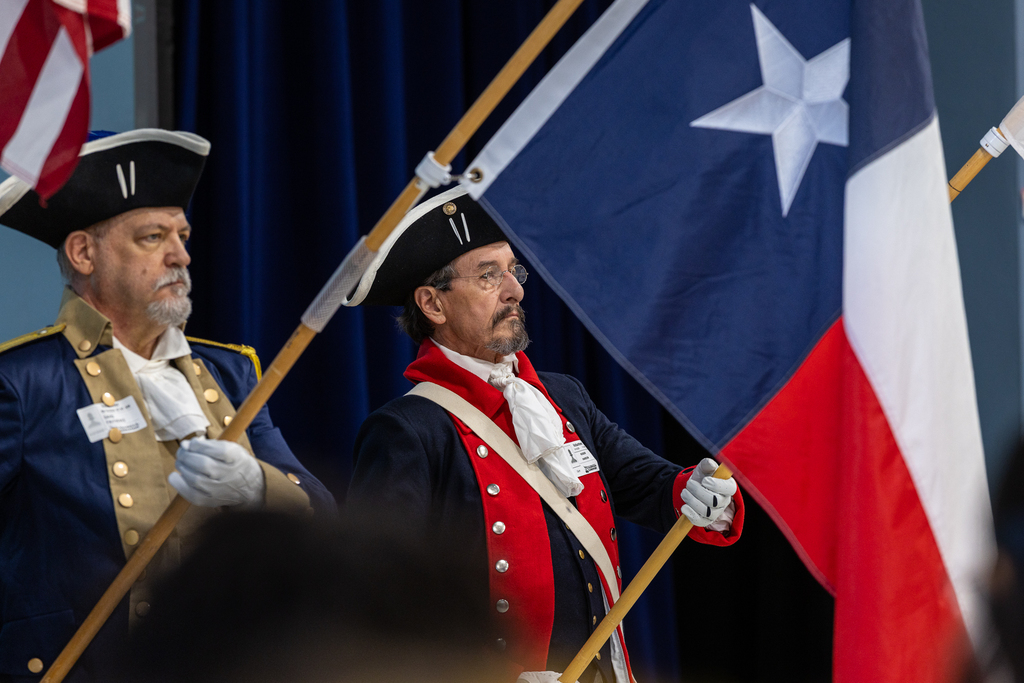 sons of the american revolution color guard holding flags