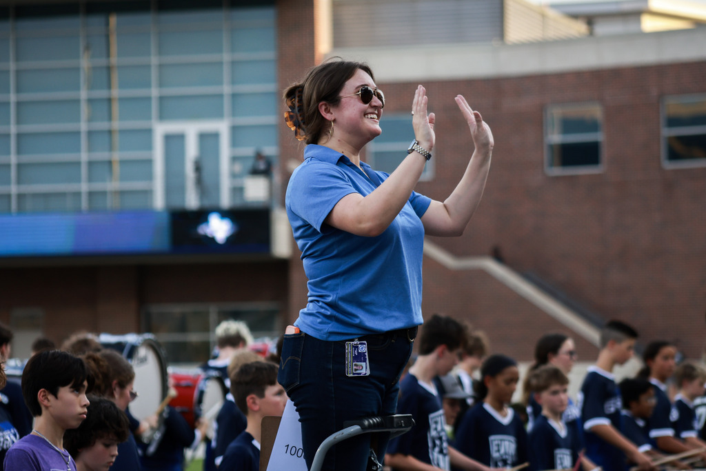a staff member directs a band at mckinney isd band night 