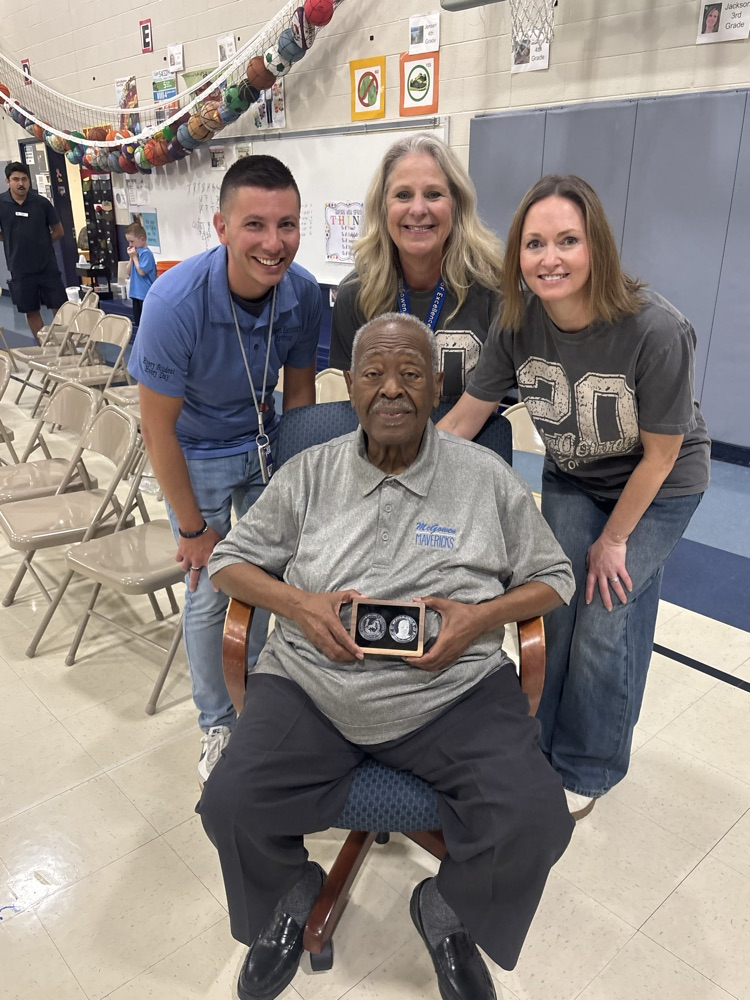 presenting Mr. McGowen with McGowen 20 years of Excellence Coin