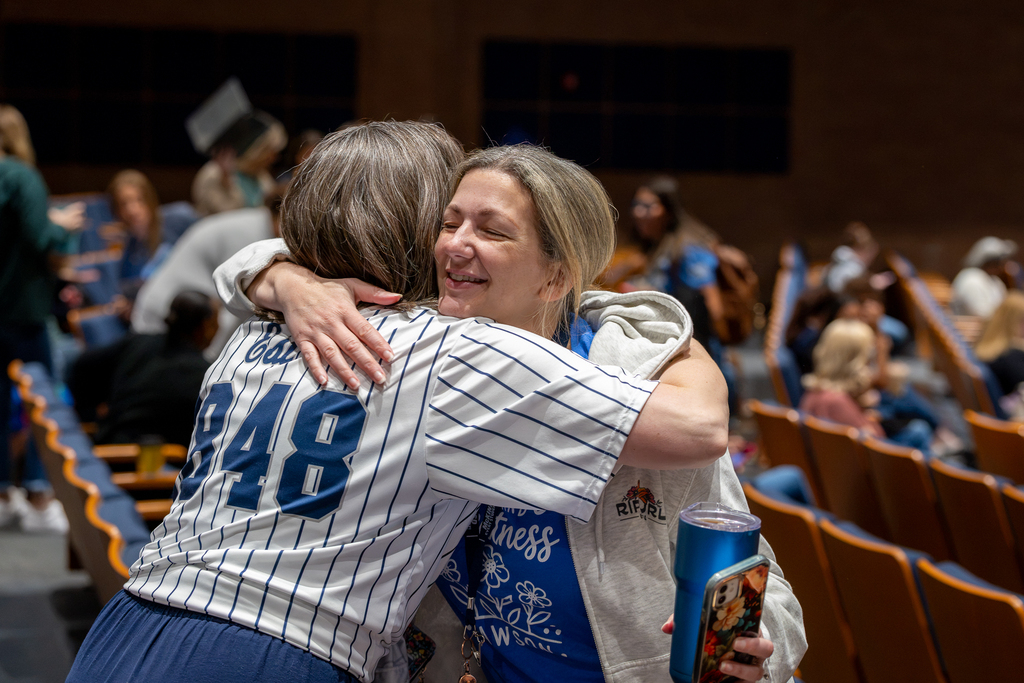 two female teachers hugging