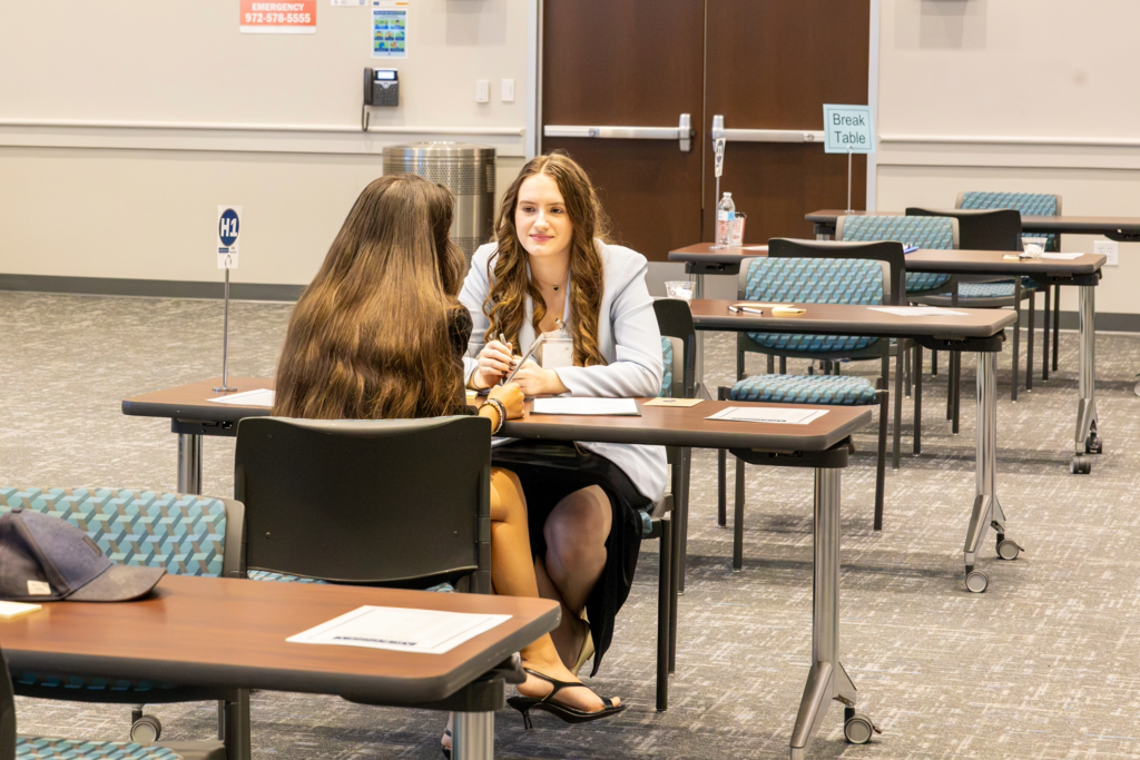 students participate in interviews at the ism business symposium 